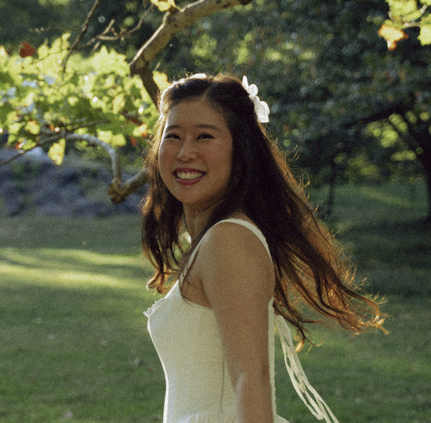 Kaitlyn, founder of By Bobbie, smiling outside